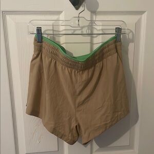 Fabletics Tan Athletic Shorts with Relaxed Fit